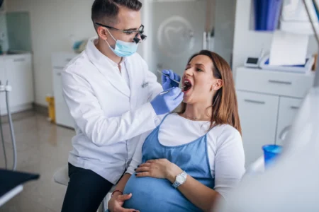 Woman setting in dentist chair